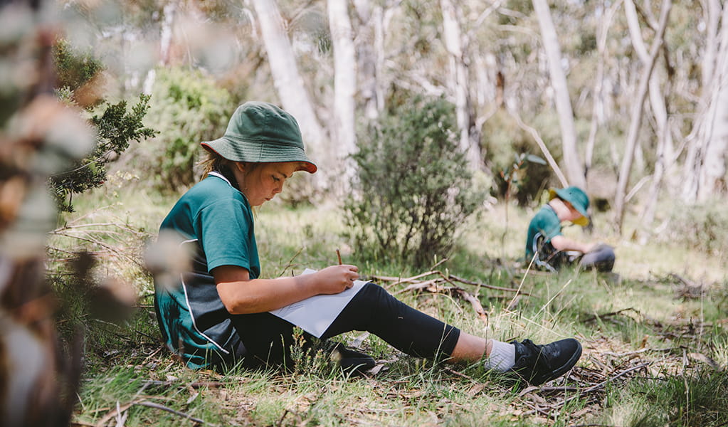 Student working on an activity in Kosciuszko National Park. Photo: Remy Brand &copy; DPE