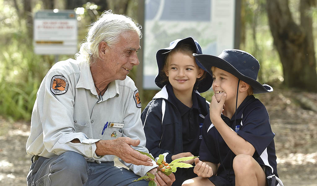 A NSW National Parks guide with a pair of students on a school excursion. Photo: Adam Hollingworth &copy; DPE