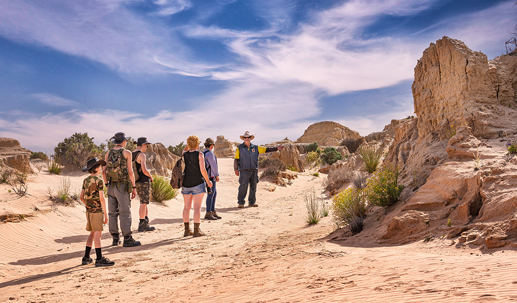 A NSW National Parks ranger guides a group around Mungo National Park. Photo: Aaron Davenport &copy; DPE