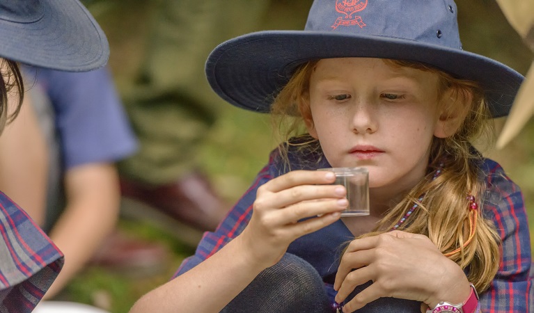 A student participating in a scientific hands-on activity during a school excursion. Photo: J Spencer/OEH