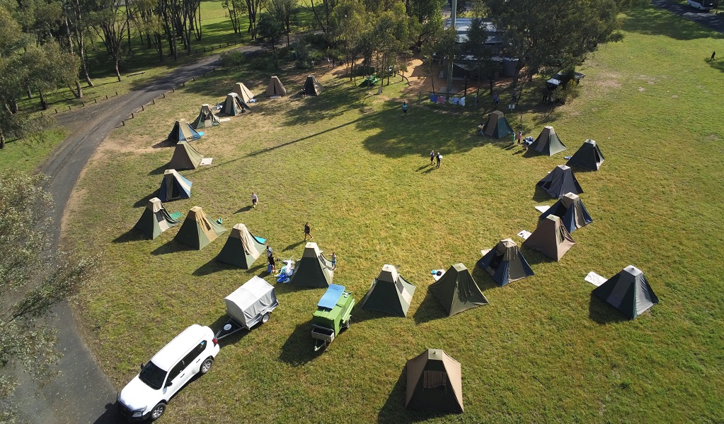 Aerial shot of students' tents pitched in a ring on the grass, ready for an overnight stay beside Warrumbungle Environmental Education Centre. Credit and &copy; Warrumbungle Environmental Education Centre 