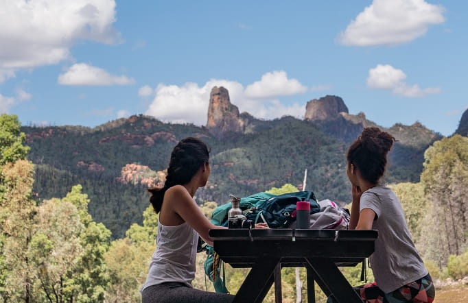 Two friends admire the scenery from the Warrumbungle Visitor Centre, Warrumbungle National Park. Photo: Rob Mulally &copy; DPIE