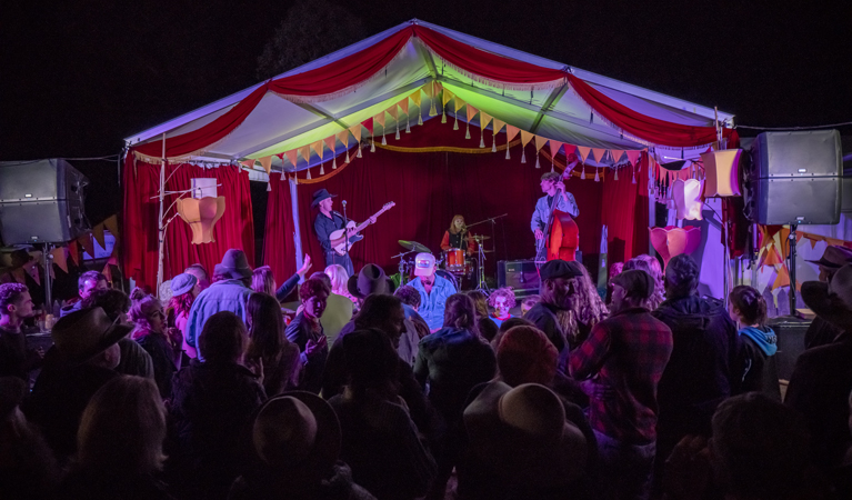 People dancing in the Golden Age Garden while That Red Head play on the Golden Age Stage, Hill End Historic Site. Photo: John Spencer/OEH