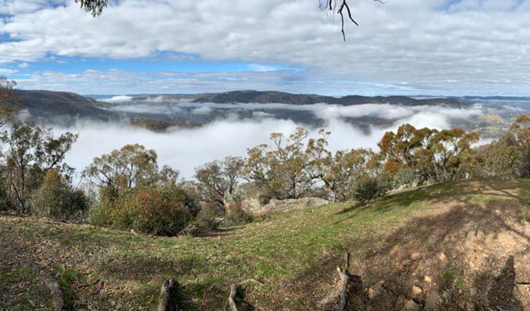 The view from a lookout of rolling hills shrouded in cloud on a 4WD tag-along camping tour with Adrenalin Offroad Centre. Photo: Ben Carceller &copy; Adrenalin Offroad Centre