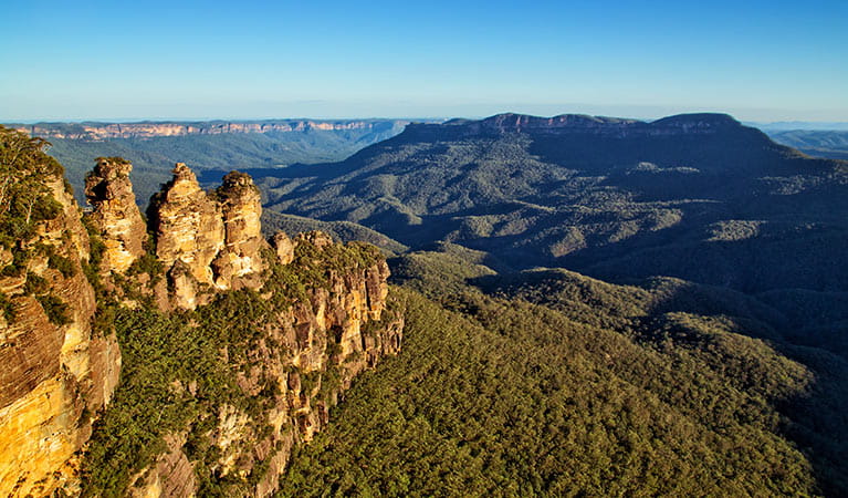 View of the Three Sisters rock formation and distant valleys and mountains in Blue Mountains National Park. Photo &copy; Auswalk Walking Holidays