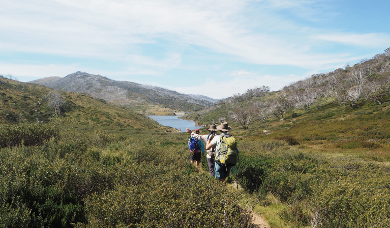 3 hikers walking on a trail in Kosciuszko National Park. Photo: Auswalk
