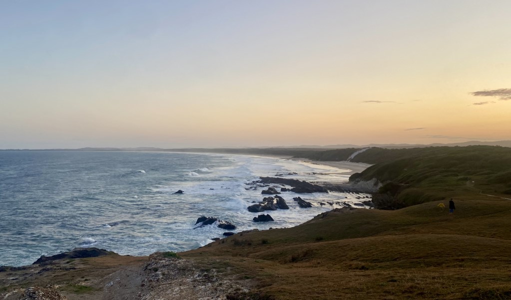 A view of the ocean and coastal headlands at sunset in Yuraygir National Park. Photo: Connect Adventures &copy; Connect Adventures.