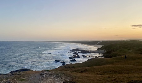 A view of the ocean and coastal headlands at sunset in Yuraygir National Park. Photo: Connect Adventures &copy; Connect Adventures.