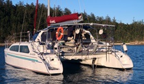 An Eco Sailing Cruises boat on the river with shoreline and trees in the background. Photo: &copy; Eco Sailing Cruises