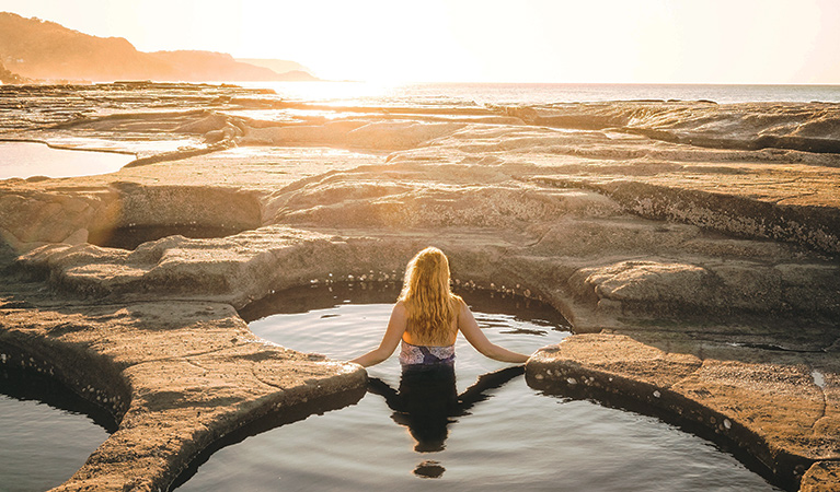 View of a young woman bathing at Figure Eight Pools in Royal National Park. Photo © Joe Bird