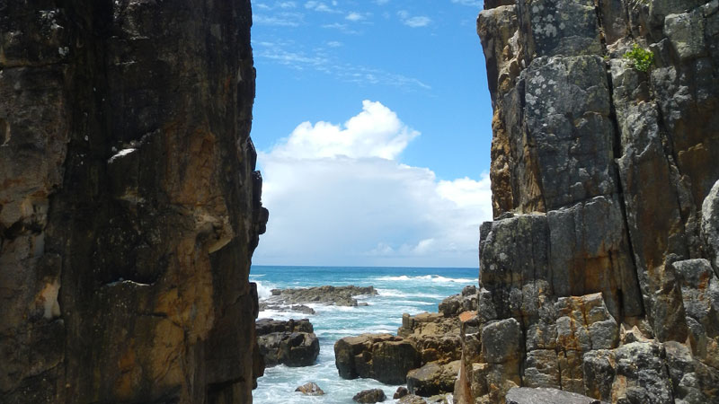 Rocks and ocean at Diamond Head Beach in Crowdy Bay National Park. Photo: Debby McGerty &copy; DPIE