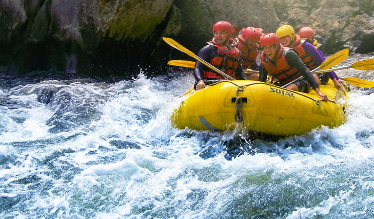 A group of people in an Exodus Adventure inflatable raft shoots a section of whitewater along the Upper Nymboida River, near Coffs Harbour. Photo &copy; Exodus Adventures