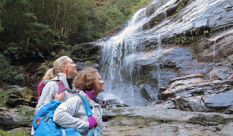 Two women viewing a waterfall on a luxury Blue Mountains trekking trip with GirlsTrek. Photo: Helen Lucas &copy; GirlsTrek