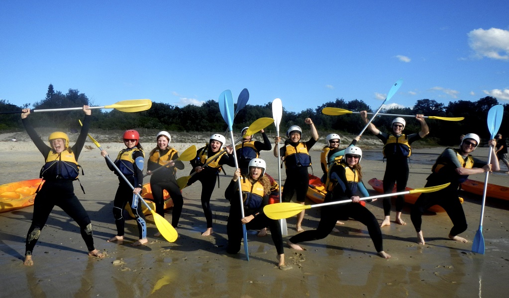 Tour group in wet suits read for their sea kayak adventure with Go Sea Kayak Byron Bay. Photo: Kurt Tutt &copy; Go Sea Kayak Byron Bay