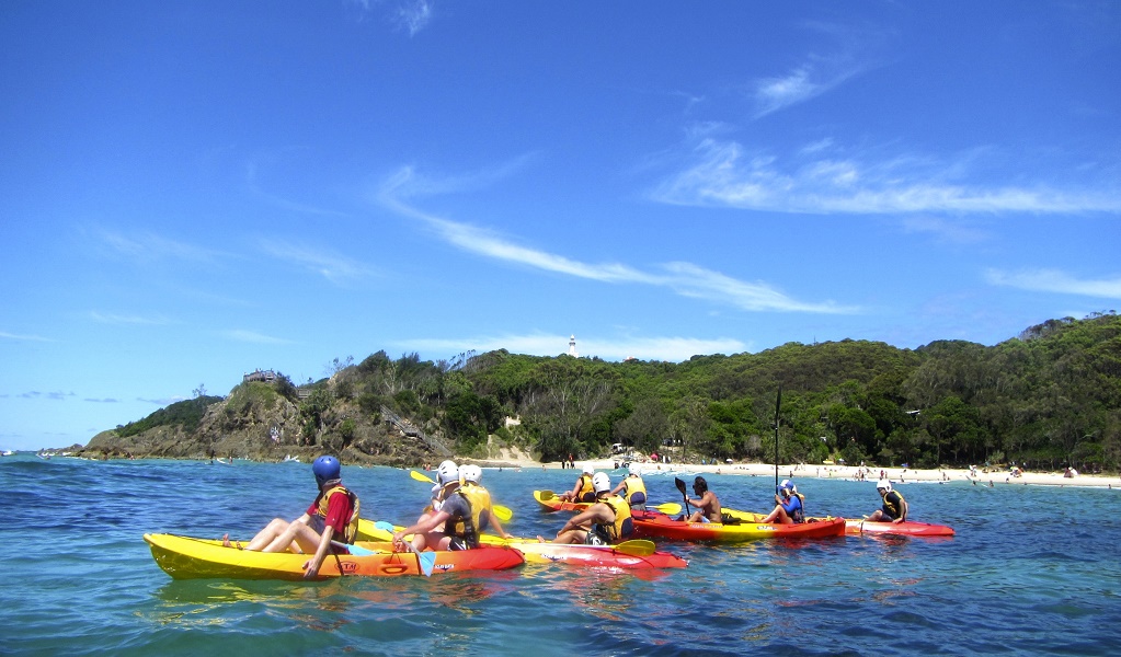 Group touring the crystal clear waters of Cape Byron Marine Park with Go Sea Kayak Byron Bay. Photo: Kurt Tutt &copy; Go Sea Kayak Byron Bay