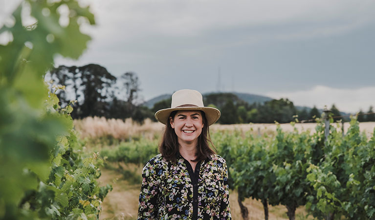 Ali, the host of The Orange Wild Weekend standing in a vineyard in Orange. Photo: Emily Ellis © Lokale Blumen