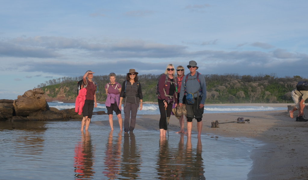 Group of people walking along beach in Beowa National Park. Photo: &copy; Park Trek Walking Holidays