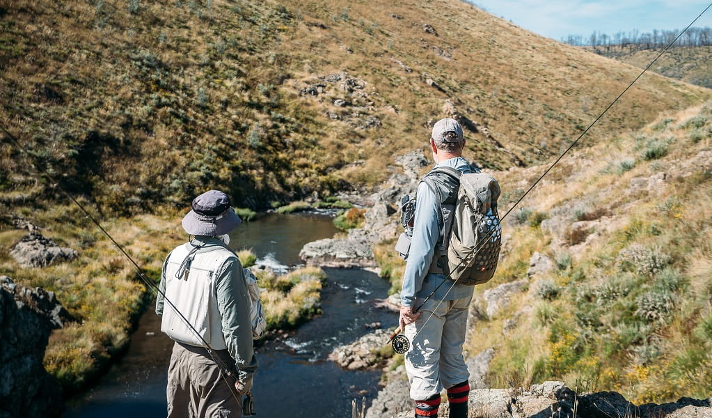 Two people checking out a fishing spot in the Snowy Mountains on a Snowy Valleys Fly Fishing tour. Photo &copy; Jimmy Barwick