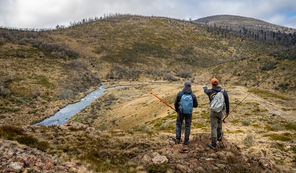 Walkers surveying a stream in the high country of Kosciuszko National Park on a Tom’s Outdoors tour. Photo: Dean Johnson &copy; Tom’s Outdoors