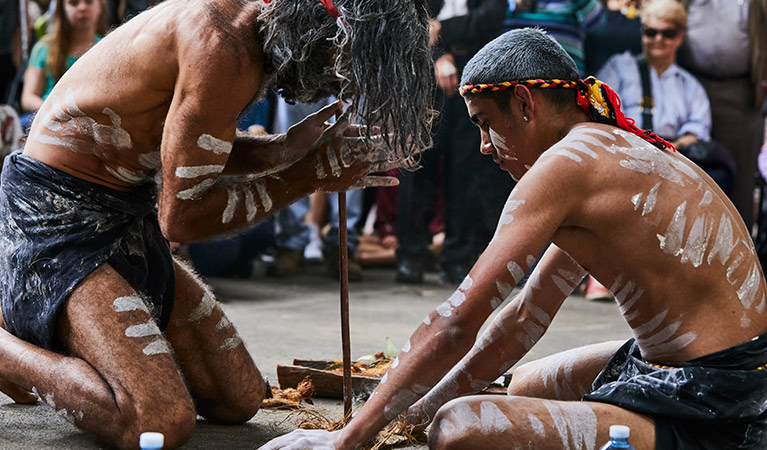 Two men share the Aboriginal cultural tradition of fire starting with visitors. Photo credit: Flash Point Labs &copy; Tribal Warrior