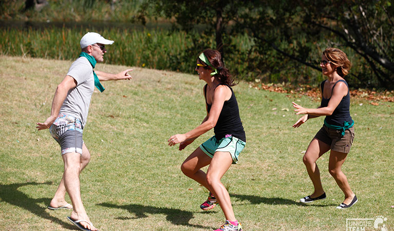 3 people take part in a team building activity with Unique Team Building. Photo: Andrew Richards © Unique Team Building