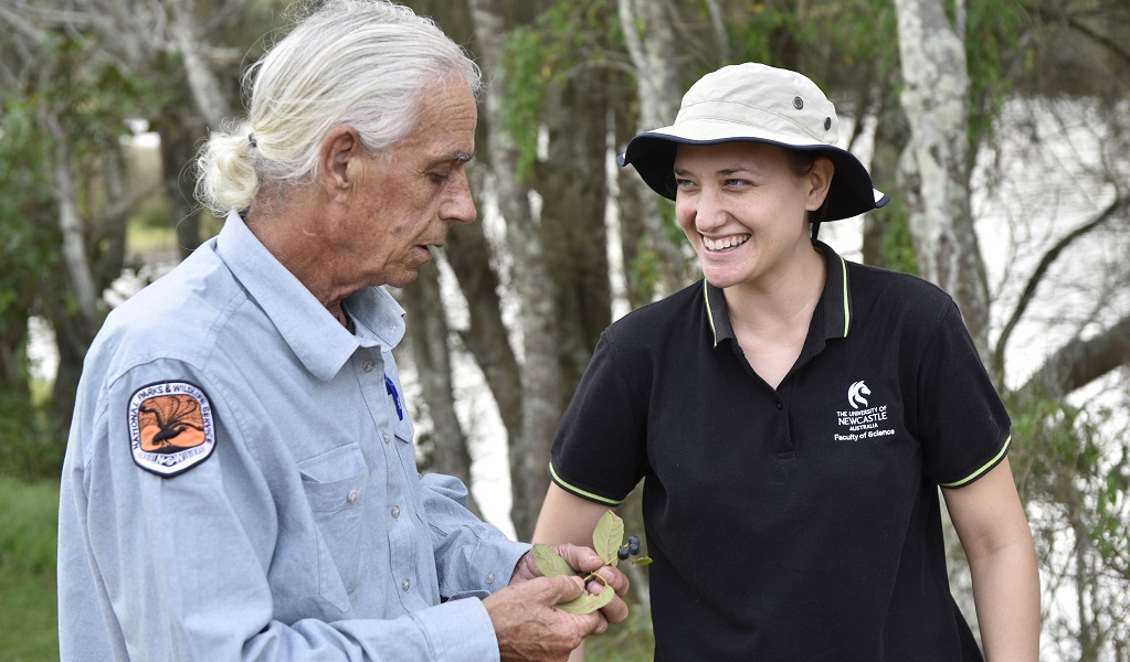 An Aboriginal guide talks with a young person during a NSW National Parks' Aboriginal cultural tour. Photo: Adam Hollingworth/DCCEEW &copy; DPE