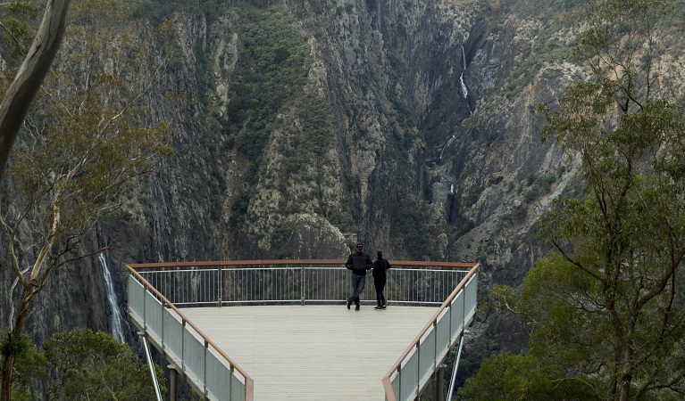 Two people admire the view from the new Wollomombi lookout, Oxley Wild Rivers National Park. Photo: Leah Pippos © DPIE