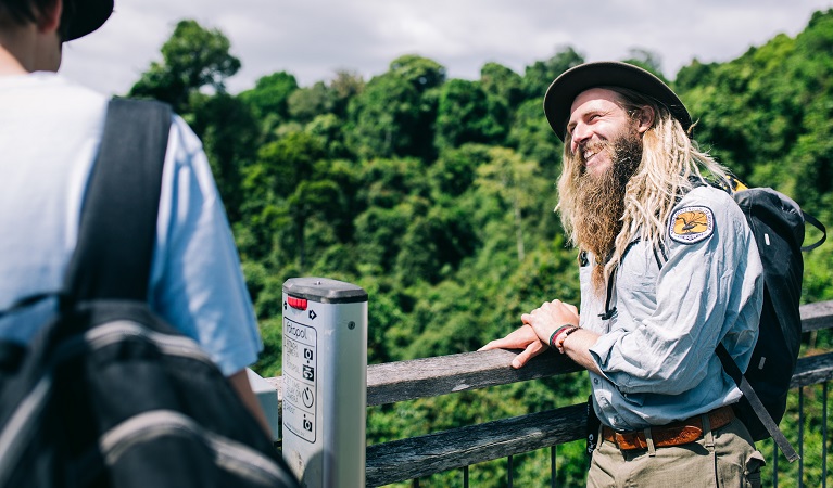 An NPWS guide answers a visitor's question, Dorrigo National Park. Photo: Jay and the Trees Photography &copy; DPIE