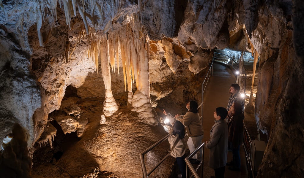 A group of visitors check out stalactites and stalagmites at Jenolan Caves. Photo: Jenolan Caves &copy; DPE