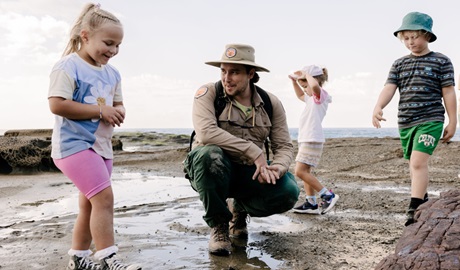 NPWS Ranger with 3 children on a guided tour of the shoreline. Photo: Zain Kruyer &copy; DCCEEW