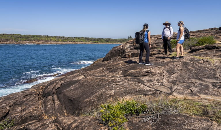 Walkers enjoying view from the rock platform at Tomaree National Park. Photo: John Spencer &copy; DPE