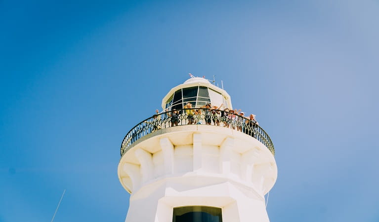 A man enjoys the ocean views from the top of Smoky Cape Lighthouse. Photo: David Finnegan/OEH