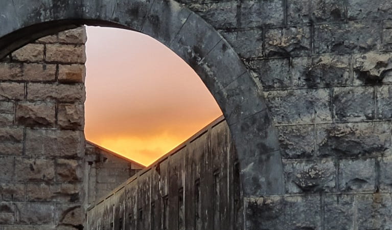 Sunset above the Trial Bay Gaol walls, Arakoon National Park. Photo: Carolyn McPhee &copy; DPIE 