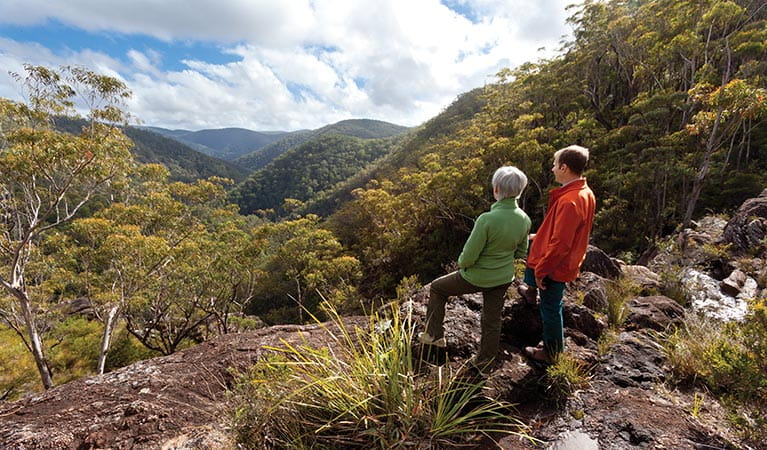 A couple of hikers looking over the valley in Gilbraltar Range National Park. Photo: Rob Cleary