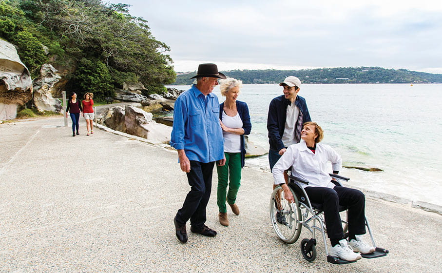 Visitors on the wheelchair accessible path at Shark Beach, Nielsen Park. Photo: Simone Cottrell/DPIE