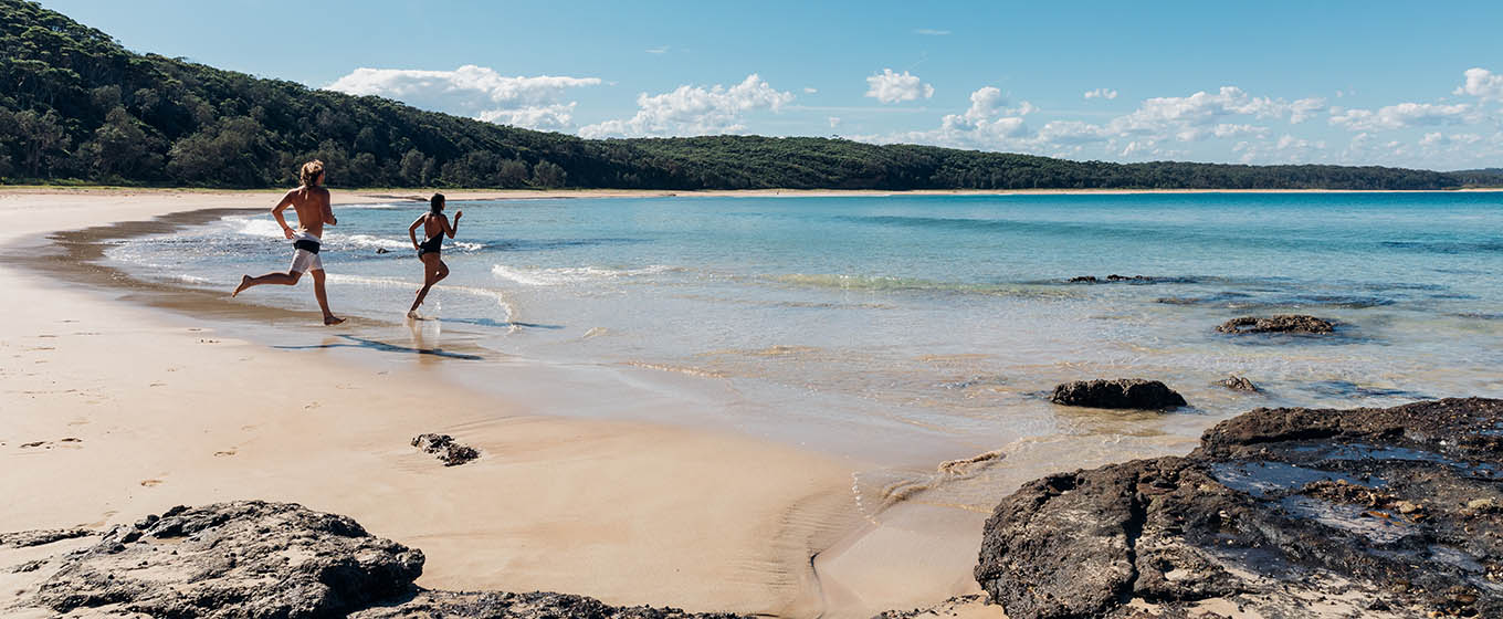 People running on beach in Murramarang National Park. Photo: Melissa Findley