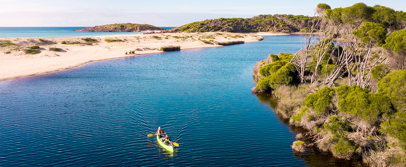 People kayaking on Bournda Lagoon, Bournda National Park. Photo: Daniel Tran