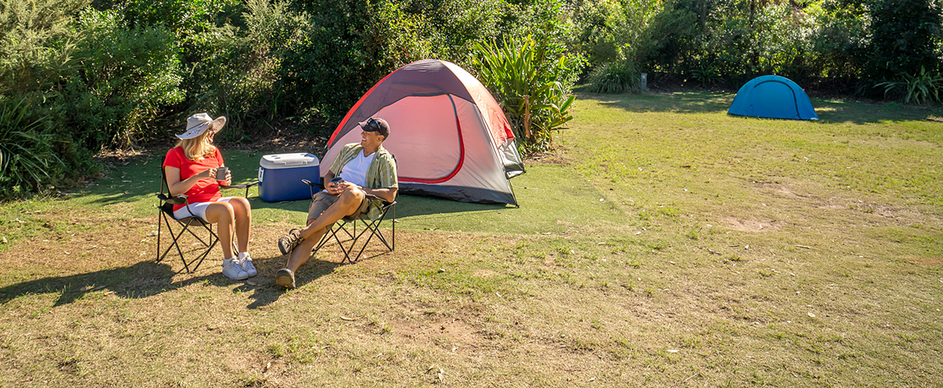 Campers relaxing at Putty Beach campground, Bouddi National Park. Photo: John Spencer/DPIE