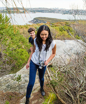 Bushwalkers on the Manly scenic walkway, Sydney Harbour National Park. Credit: Simone Cottrell &copy; DPE