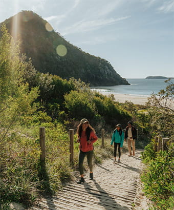 Walkers near Zenith Beach in Tomaree National Park. Credit: Remy Brand &copy; DPE