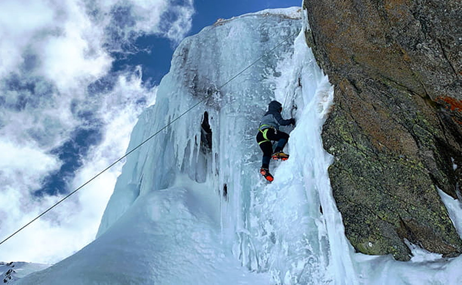 A roped climber ascends a curtain of ice in Kosciuszko National Park. Photo credit: Allie Pepper &copy; Allie Pepper Adventures