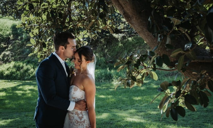 A newlywed couple pictured amongst the lush green surrounds at Sydney Harbour National Park. Photo: Matthew Horspool © DPIE