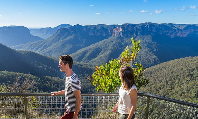 Bushwalkers take in lookout views at the start of Govetts Leap descent near Blackheath, in Blue Mountains National Park. Photo: Simone Cottrell/DPIE