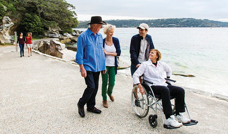 Visitors on the wheelchair accessible path at Shark Beach, Nielsen Park. Photo: Simone Cottrell &copy; DPE