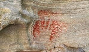 An Aboriginal ochre hand painting at Red Hands Cave, Ku-ring-gai Chase National Park. Photo: agmtraveller
