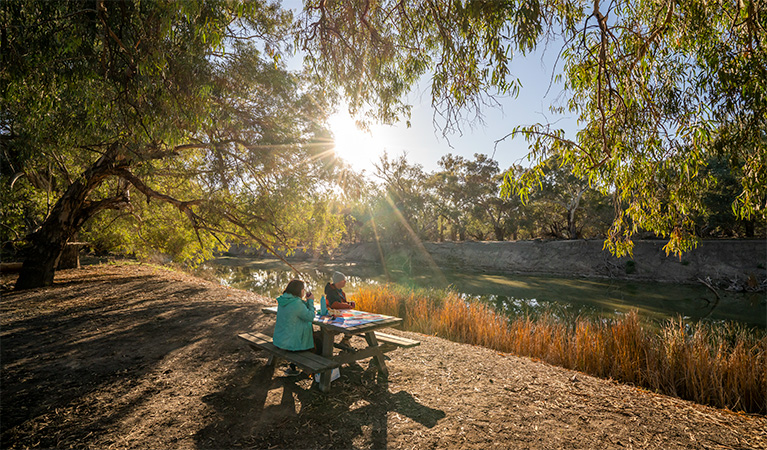 People picnicking at Darling River campground. Photo: John Spencer &copy; DPE
