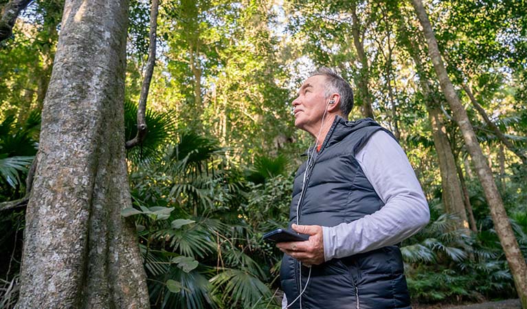People listening to an audio tour in an NSW national park. Photo credit: John Spencer © DPIE