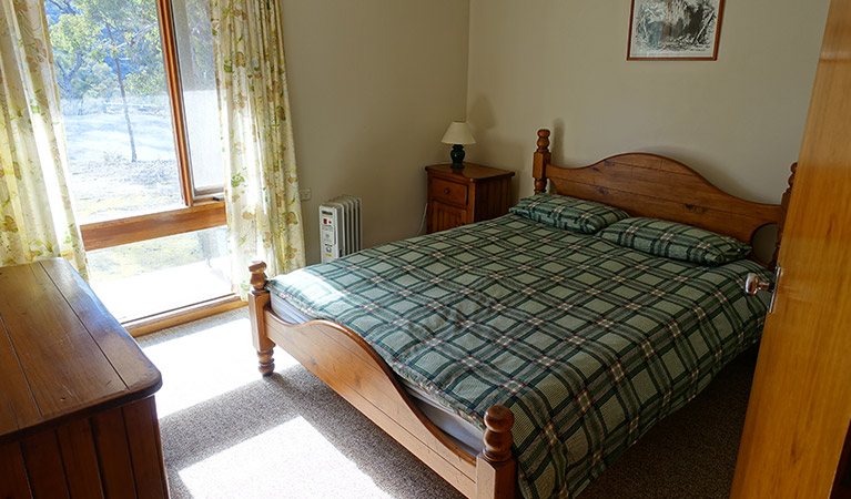 Queen bedroom inside Arch Cottage, Abercrombie Karst Conservation Reserve. Photo: Stephen Babka/DPIE