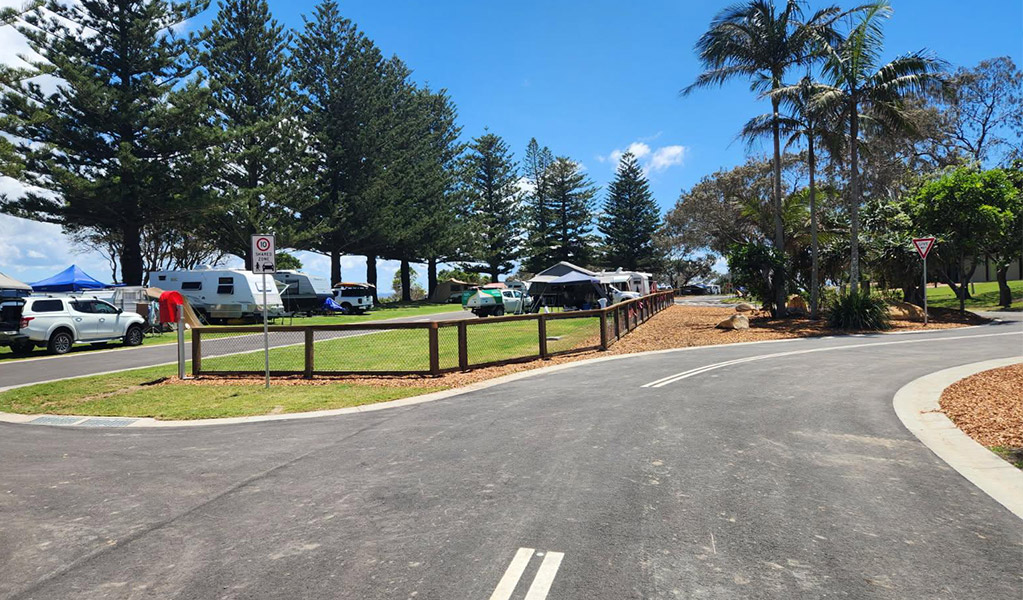 View of campsites and the access road at Trial Bay Gaol campground. Credit: Brandan Argent &copy; DCCEEW