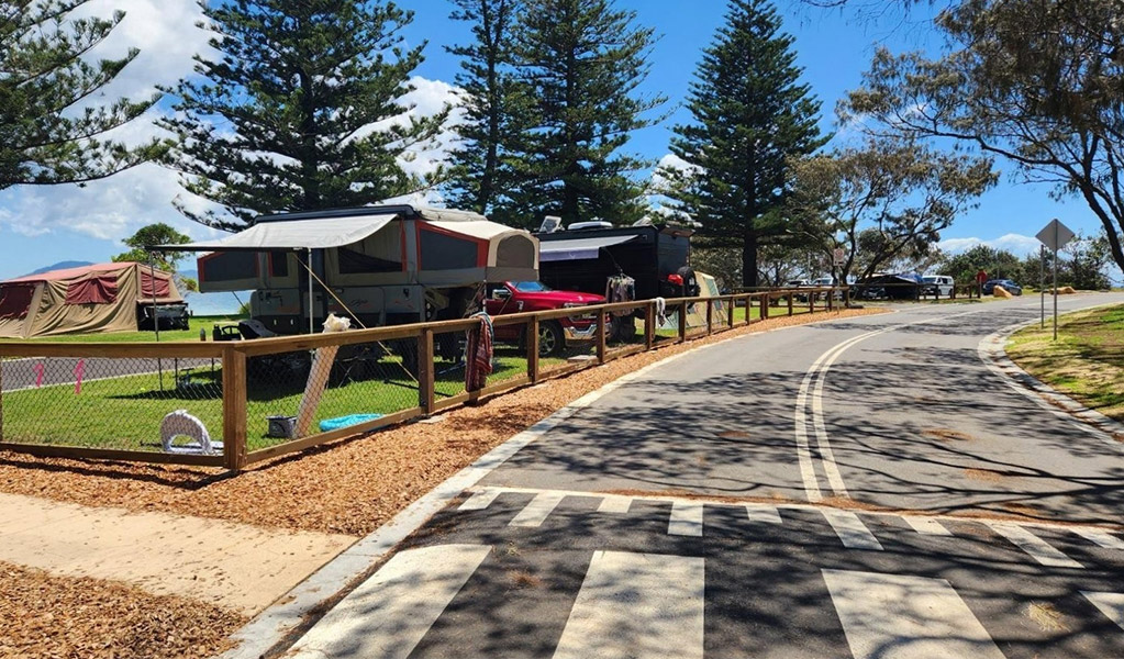 View of campsites and the access road at Trial Bay Gaol campground. Credit: Brandan Argent &copy; DCCEEW